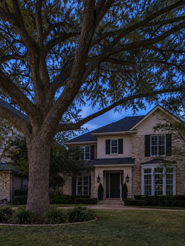 Home before Christmas light installation: wrapped oak & roofline